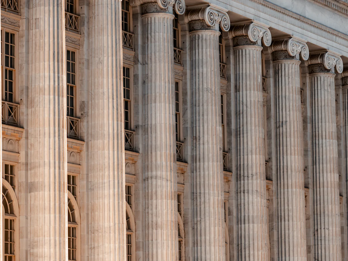 A large building with columns and a clock